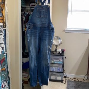 Torrid distressed jean overalls.